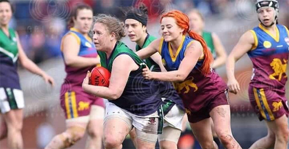 Maddog Kate Sullivan busting through a tackle in 2017.