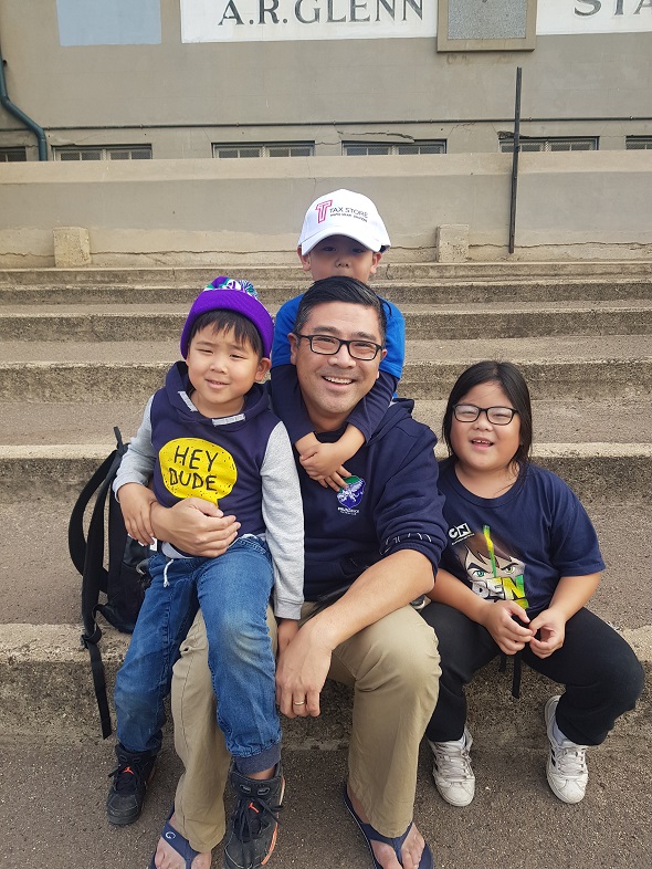 Vu Nguyen with three of his kids Kurt, Alanah and Evan (Tax Store cap).